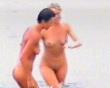 2 pretty woman in merry mood at nudist beach 